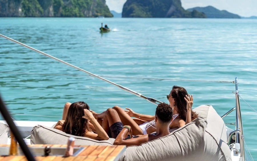 group of friends chilling on a yacht in Phuket Thailand